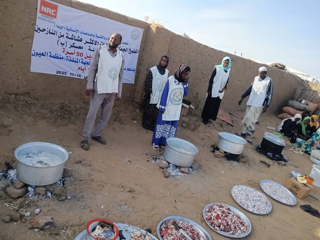 Volunteers handing meals to children